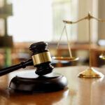 Judge,Gavel,With,Justice,Lawyers,Having,Team,Meeting,At,Law